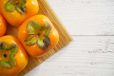 fresh ripe Persimmon or Chinese date plum persimmon photo