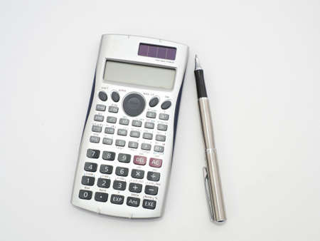Scientific calculator pen and notepad on white background picture.の写真素材