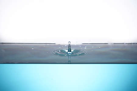 image of water droplets in a water sourceの写真素材