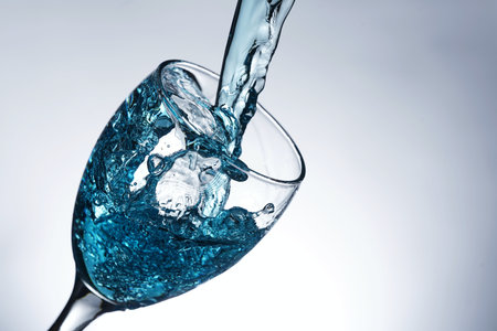 image of pouring water into a glassの写真素材