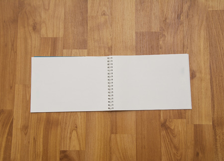 Note book on wooden background