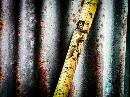 measuring tape against zincの素材