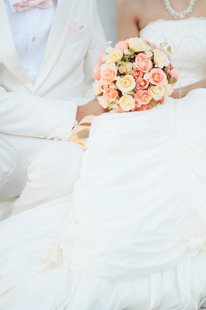 groom and bride with bouquetの写真素材