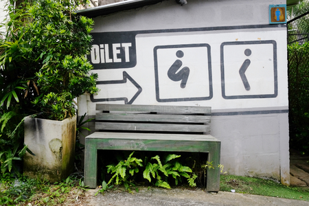 Toilet sign in public park gardenの写真素材