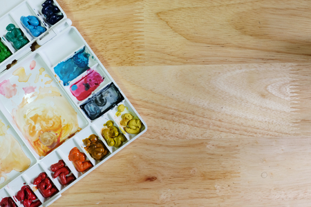 Palette of watercolor and Circle Palette of Acrylic color paints on white background-copy spaceの写真素材