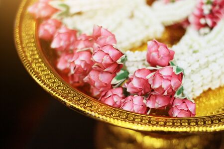 Flower garlands on a gold tray in tradition Thai wedding ceremony day. Jasmine garland.の写真素材