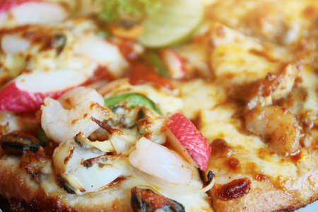 Slice of pizza cheese and seafood with sauce. Food of italian traditional.の写真素材