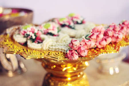 Flower garlands on a gold tray in tradition Thai wedding ceremony day. Jasmine garland.の写真素材
