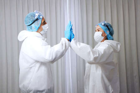 Powerful and energy of Medical team in Personal Protective Equipment or PPE clothing and Healing for...