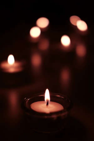 Candle light in Glass cup decoration in spa and christmas night party in Bokeh background. Holiday and Romantic love on valentines day Concept.の写真素材