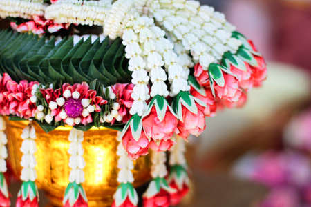 Flower garlands on a gold tray in tradition Thai wedding ceremony day. Jasmine garland.