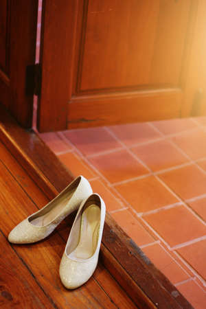 Bride shoes on wooden floor. Wedding shoesの写真素材
