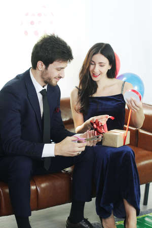 Sweet couple Love smile and spending Romantic christmas time and celebrating new year eve, birthday,...