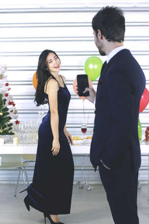 Sweet couple Love smile and spending Romantic for Take a picture with a mobile phone in christmas...