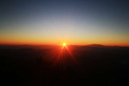 Beautiful golden natural sunlight and twiligh of sunrise shining to in the mist on valley of...
