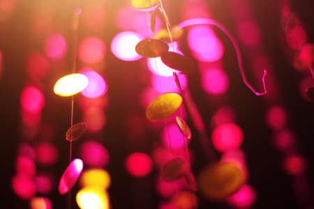 Glamour Ultra Violet sparkling and purple glitter bokeh of metallic circle. Multicolored Christmas...