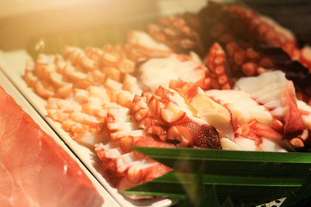 Squid slice on trays in Japanese food Resturantの写真素材