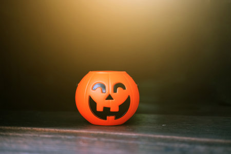 Halloween pumpkin head with golden light in dark night bakckground. Halloween holiday concept.の写真素材