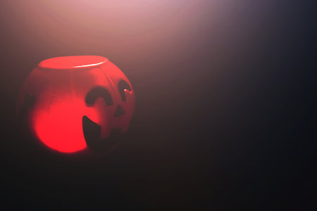 Halloween pumpkin head with golden light in dark night bakckground. Halloween holiday concept.の写真素材