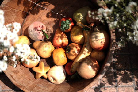 Plastic fruits in woven basket decoration in gardenの写真素材