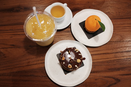 Homemade fresh Chocolate Hazelnut cake with orange cake and cream on chocolate Hazelnut and orange...