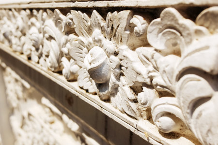 Details of the floral stucco carvings in the ancient temple exterior in Thailandの写真素材