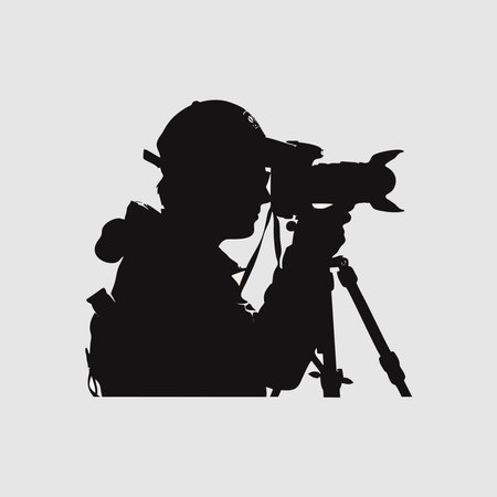 Vector illustration of a video camera operator silhouette on a gray background.のイラスト素材