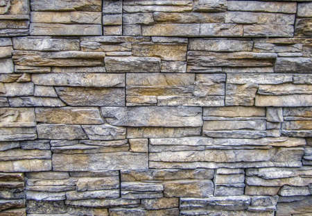 Background of stone wall texture photo の写真素材