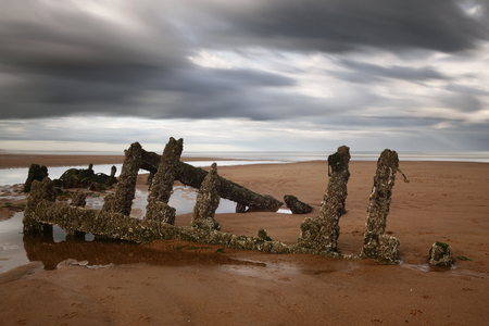 A long exposure image of a ship wreck on Balmedie beach, Aberdeenshire.の写真素材