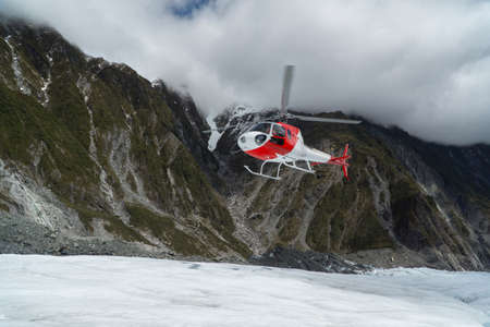 Helicopter landing on Franz Josef Glacier, South Island.の写真素材