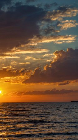 Sunset on the sea. Beautiful sunset over the sea. The sun's rays make their way through the clouds.の写真素材