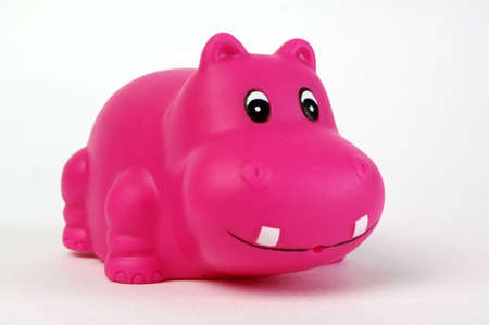 pink plastic hippopotamus toy on white backgroundの写真素材