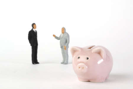 piggy bank and miniatures mensの写真素材
