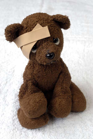 teddy-bear with a bandageの写真素材