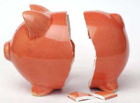 Broken piggy bank on white backroundの写真素材