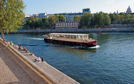 Boat in Seine river in Paris, France のeditorial素材