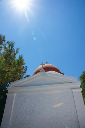 The orthdox church with blue sky and tree of Greece island.の写真素材