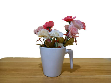 A vase of flowers is placed on the table.の写真素材