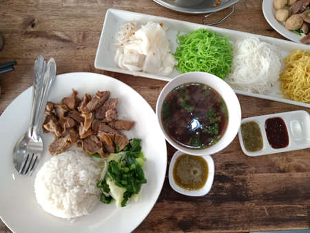 Thai food rice. on a wooden table, top view.