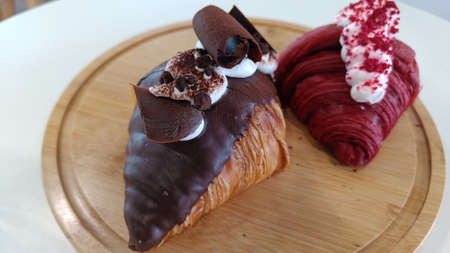 Chocolate Croissant on the wood plate background Blur Red Velvet Croissantの写真素材