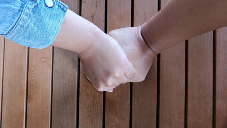 Male and female couple hands in hands build love relationshipの写真素材