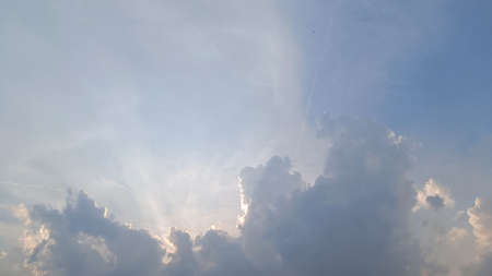 Beautiful blue sky sunshine from the clouds on a hot dayの写真素材