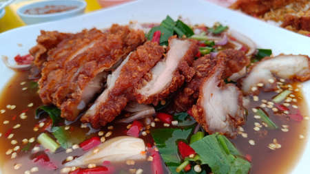 Spicy Fried Chicken Salad with Isaan Thai Foodの写真素材