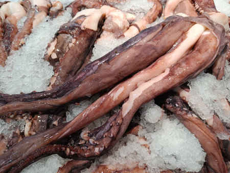 Octopus legs on ice, sale in the market.