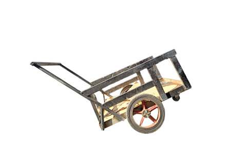 Small rusty old black cargo cart on white background.の写真素材