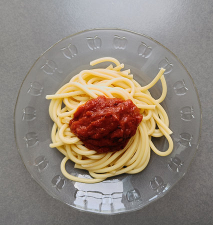 Spaghetti noodles tomato sauce on plate, Top viewの写真素材
