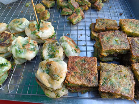 Fried Garlic chives cake are sale at the flea market.の写真素材