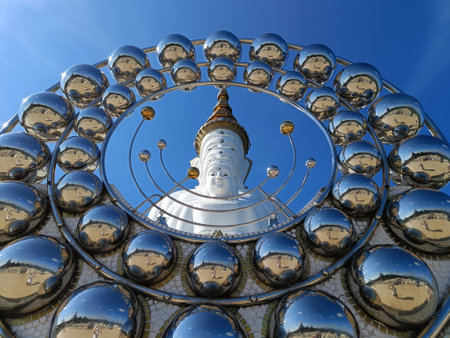 Phetchabun, Thailand - October 26, 2022: Front view Beautiful Buddha statue against blue sky and clouds in Thailand temple, Wat Phra That Phasornkaew Khao Kho District, Phetchabun provinceのeditorial素材
