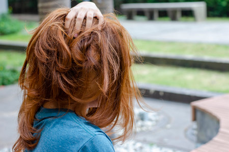 Blonde Asian woman with messy hair