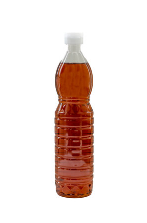Fish sauce in a clear plastic bottle isolated on white background with clipping pathの写真素材
